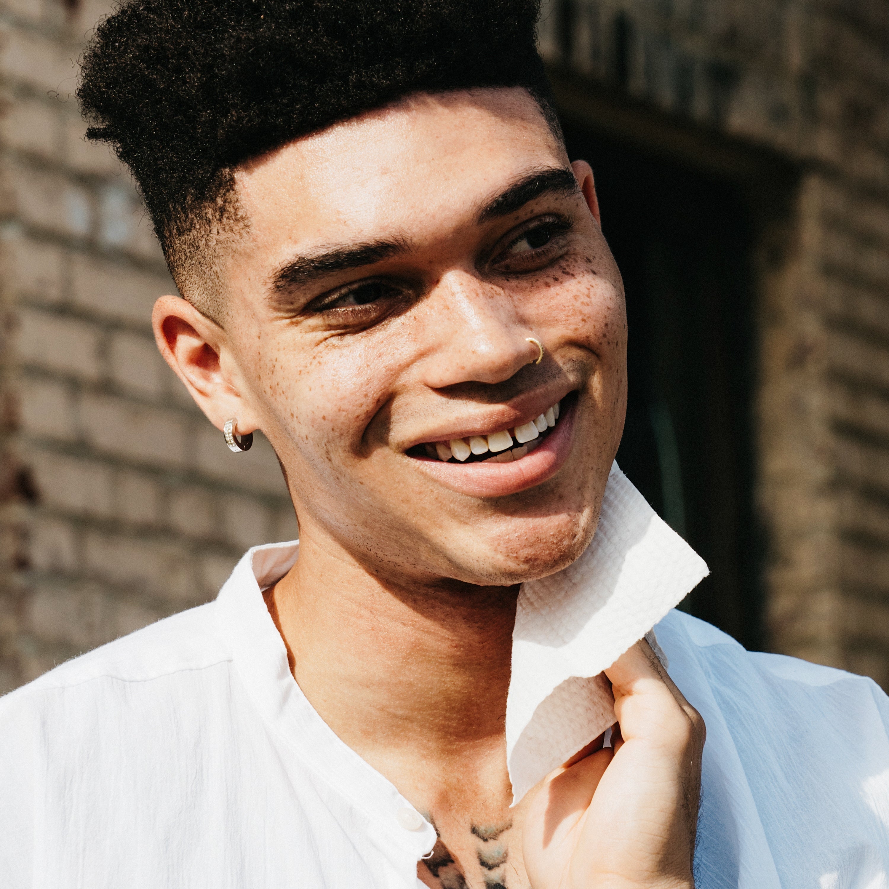 Smiling man using the wipes on face